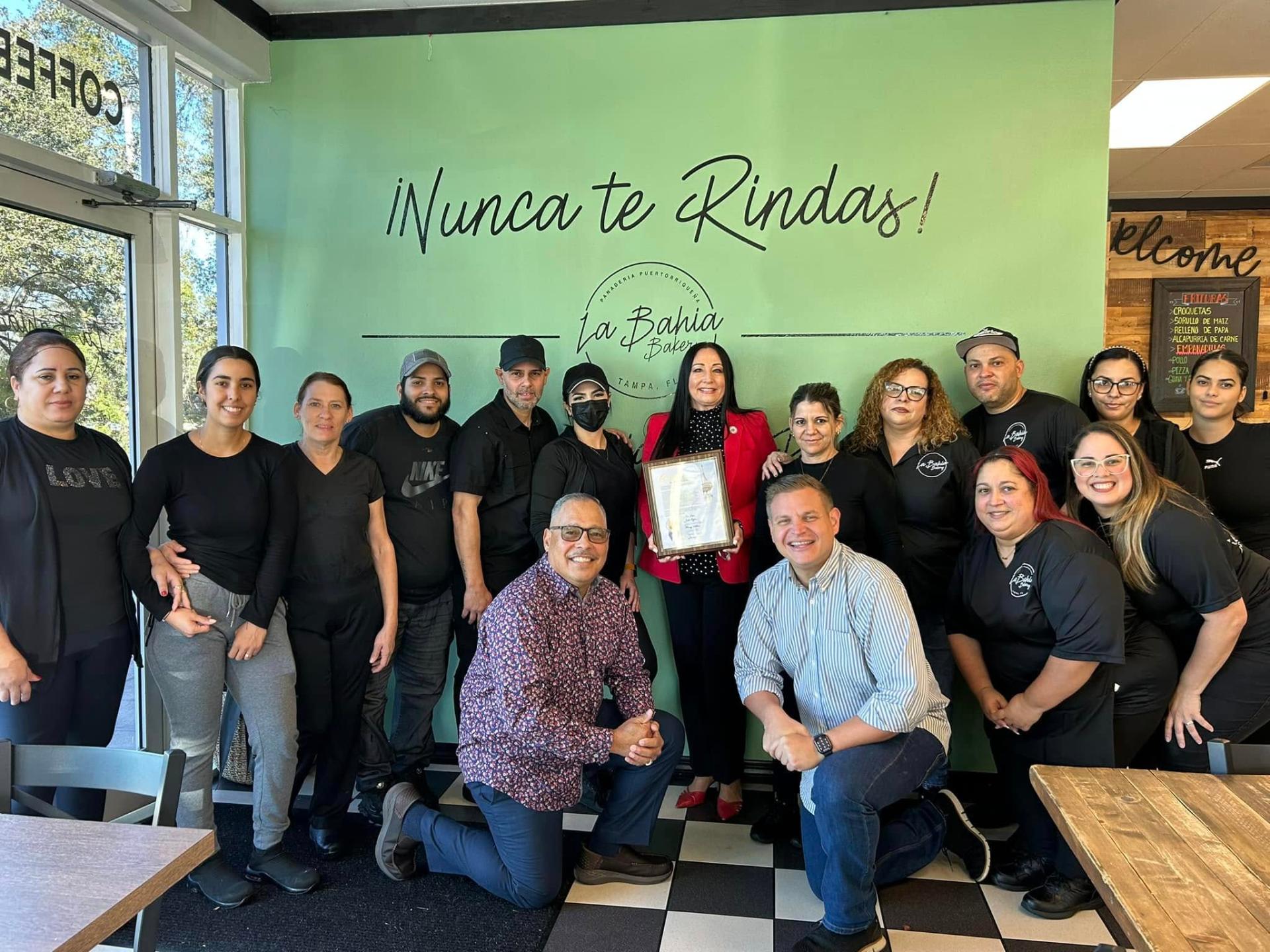 Donna presenting a proclamation to the team at La Bahía Bakery in Tampa