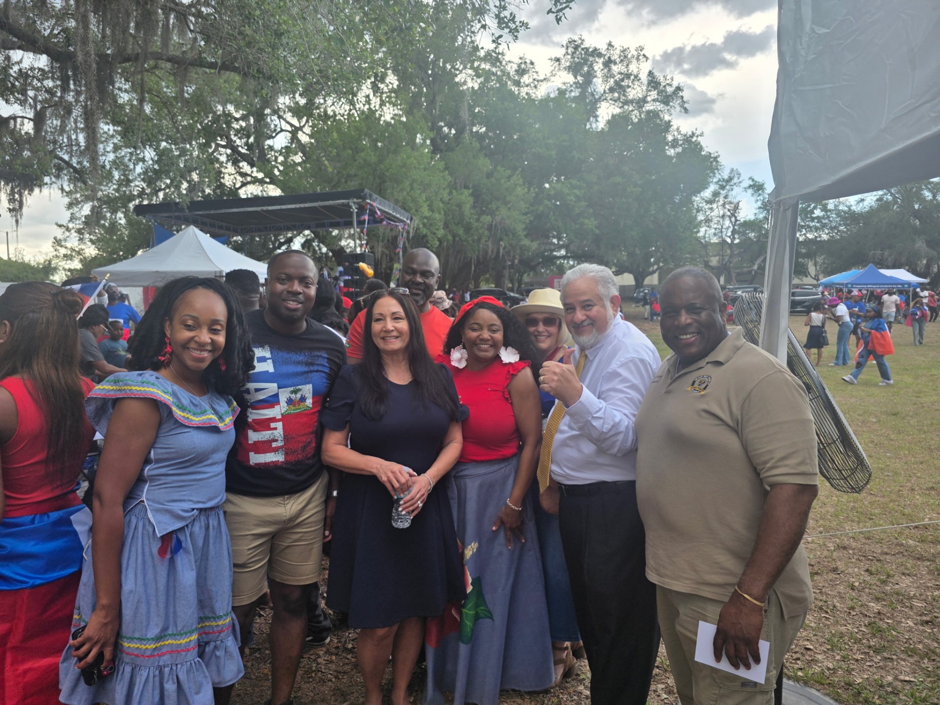 Donna with families and local leaders at a Haitian community celebration