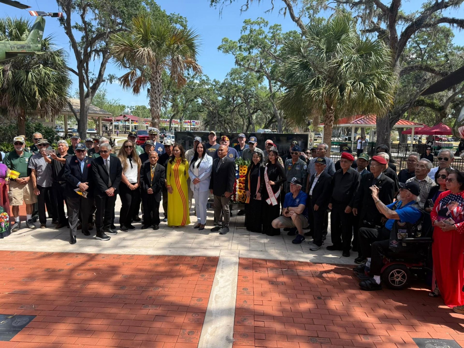 Donna with Vietnamese American veterans and community members at a memorial wreath-laying ceremony
